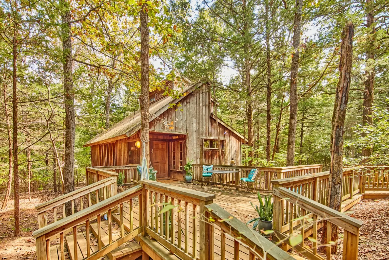 Dragonhead Retreat secluded East Texas Cabin near Canton with front deck with trees and ADA access.